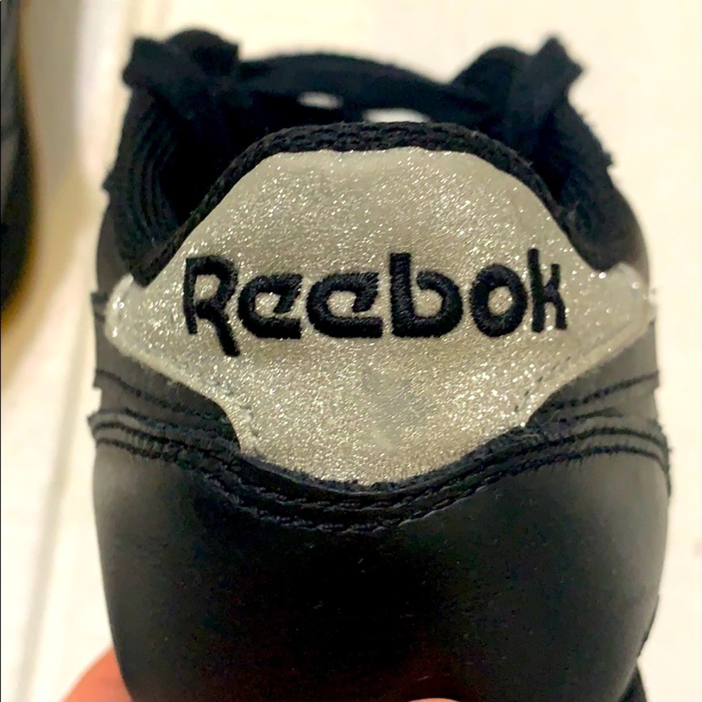 Women’s all black Reebok’s shoes